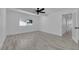 Neutral bedroom featuring neutral paint, ceiling fan, and modern wood-look flooring at 1905 E Oakey Blvd, Las Vegas, NV 89104