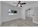 Bedroom featuring new floors, neutral walls, and a mirrored closet at 1905 E Oakey Blvd, Las Vegas, NV 89104
