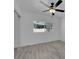 Cozy bedroom with neutral walls, new floors, a ceiling fan and large window at 1905 E Oakey Blvd, Las Vegas, NV 89104