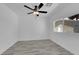 Bright bedroom featuring neutral paint, ceiling fan, and modern wood-look flooring at 1905 E Oakey Blvd, Las Vegas, NV 89104