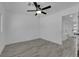 Minimalist bedroom with ceiling fan, neutral walls, and new floors at 1905 E Oakey Blvd, Las Vegas, NV 89104