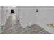 Bright hallway featuring luxury vinyl flooring and a view of the updated kitchen at 1905 E Oakey Blvd, Las Vegas, NV 89104