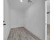 The hallway features neutral paint, wood-look flooring and doors with white trim at 1905 E Oakey Blvd, Las Vegas, NV 89104