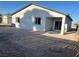 Image shows the backyard of the house with a covered patio and space for landscaping at 1905 Harvard St, North Las Vegas, NV 89030