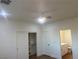 This bedroom has a ceiling fan, closet, and ensuite bathroom at 1905 Harvard St, North Las Vegas, NV 89030