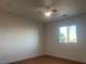 Bright bedroom featuring hardwood floors, neutral wall color, and a window view at 1905 Harvard St, North Las Vegas, NV 89030