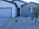 Charming single-story home with a two car garage and a low maintenance rock yard at 1905 Harvard St, North Las Vegas, NV 89030