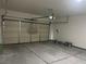View of a spacious two car garage, with door opener and epoxy floor at 1905 Harvard St, North Las Vegas, NV 89030