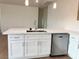 Bright kitchen featuring stainless steel appliances and an island with light countertops at 1905 Harvard St, North Las Vegas, NV 89030