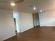 Open concept living room featuring hard wood flooring and neutral wall color at 1905 Harvard St, North Las Vegas, NV 89030