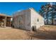 Weathered barn exterior with large double doors, presenting renovation potential and a rustic aesthetic at 1917 N Moapa Valley Blvd, Logandale, NV 89021