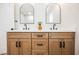 Bathroom featuring double vanity with wooden cabinets and black hardware at 1917 N Moapa Valley Blvd, Logandale, NV 89021