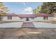 Spacious single-story house with red trim and stairs leading to the front door at 1917 N Moapa Valley Blvd, Logandale, NV 89021