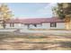Spacious single-story home with a red tile roof, white stucco and desert landscaping at 1917 N Moapa Valley Blvd, Logandale, NV 89021
