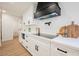 Modern kitchen with white cabinets, sleek countertops, and stainless steel appliances at 1917 N Moapa Valley Blvd, Logandale, NV 89021