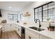 Bright kitchen featuring white countertops, modern faucet, and large windows at 1917 N Moapa Valley Blvd, Logandale, NV 89021