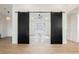 Bright office space with barn doors, featuring modern desk and chair at 1917 N Moapa Valley Blvd, Logandale, NV 89021