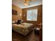 Bedroom with a ceiling fan, neutral walls, window with blinds, and wood-look floors at 2267 Muir Ct, Henderson, NV 89052