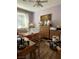 Bedroom with a ceiling fan, a window with blinds, wood-look floors, and lilac paint at 2267 Muir Ct, Henderson, NV 89052