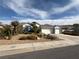 Attractive single-story home showcasing a well-manicured desert landscape, complemented by drought-resistant plants at 2267 Muir Ct, Henderson, NV 89052