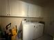 Bright laundry room with white cabinets and a newer washer and dryer set at 2267 Muir Ct, Henderson, NV 89052