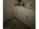 The utility sink has white cabinetry and a neutral tile floor at 2267 Muir Ct, Henderson, NV 89052