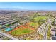This aerial shot shows baseball fields, tennis courts, and the surrounding neighborhood at 2369 Via Barranca St, Henderson, NV 89044