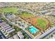 This aerial shot shows community baseball fields, tennis courts, and pool in a neighborhood setting at 2369 Via Barranca St, Henderson, NV 89044