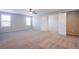 Bedroom with neutral carpet, ceiling fan, and two large windows at 2369 Via Barranca St, Henderson, NV 89044
