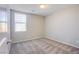 A cozy bedroom features neutral paint, carpet, and a window providing natural light at 2369 Via Barranca St, Henderson, NV 89044
