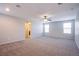 Bedroom with neutral carpet and large windows allowing for ample natural light at 2369 Via Barranca St, Henderson, NV 89044