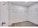 Walk-in closet with carpeted floor and metal shelving at 2369 Via Barranca St, Henderson, NV 89044