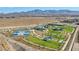Aerial view of community park showcasing a pool, basketball courts, playground, and green spaces, enhancing lifestyle at 2369 Via Barranca St, Henderson, NV 89044