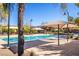A community pool offers shade and recreation at 2369 Via Barranca St, Henderson, NV 89044