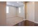 Inviting entryway with carpeted area and wood floors at 2369 Via Barranca St, Henderson, NV 89044