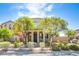 Charming two-story home featuring a well-maintained front yard and inviting entryway at 2369 Via Barranca St, Henderson, NV 89044