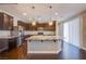 Stylish kitchen with stainless steel appliances, granite countertops and dark cabinets at 2369 Via Barranca St, Henderson, NV 89044