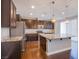 Modern kitchen featuring granite countertops and stainless steel appliances at 2369 Via Barranca St, Henderson, NV 89044