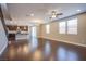 Bright, open living room with hardwood floors, ceiling fan and natural light at 2369 Via Barranca St, Henderson, NV 89044
