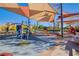 This vibrant community playground has covered seating and play structures at 2369 Via Barranca St, Henderson, NV 89044
