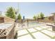 Backyard with a sparkling pool, outdoor kitchen, and a secure safety fence, great for Gathering gatherings at 2750 Evolutionary Ln, Las Vegas, NV 89138