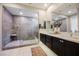 Elegant bathroom featuring a modern double vanity and a glass-enclosed shower, designed for relaxation and convenience at 2750 Evolutionary Ln, Las Vegas, NV 89138