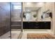Modern bathroom featuring a double vanity, a large mirror, and a glass-enclosed shower with a built-in bench at 2750 Evolutionary Ln, Las Vegas, NV 89138