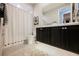 Bathroom featuring a black vanity, large mirror, and a stylish shower curtain, blending functionality with aesthetics at 2750 Evolutionary Ln, Las Vegas, NV 89138
