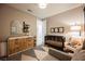 Charming Bedroom featuring a crib, changing table, and comfortable seating, perfect for a growing Gathering at 2750 Evolutionary Ln, Las Vegas, NV 89138
