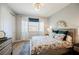 Cozy bedroom boasts a queen bed, stylish lighting, and neutral tones for a relaxing atmosphere at 2750 Evolutionary Ln, Las Vegas, NV 89138