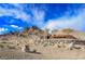 Reverence community entrance with mountain views, desert landscape, and architectural stone elements at 2750 Evolutionary Ln, Las Vegas, NV 89138