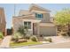 Contemporary two-story home with a well-manicured lawn, stone accents, and a two-car garage at 2750 Evolutionary Ln, Las Vegas, NV 89138