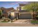 Contemporary two-story home with manicured landscaping, brick driveway, and a spacious two-car garage at 2750 Evolutionary Ln, Las Vegas, NV 89138