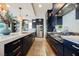 Modern kitchen with custom cabinets, stainless appliances, and a kitchen island with white countertops at 2750 Evolutionary Ln, Las Vegas, NV 89138